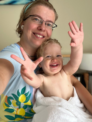 A woman and infant smiling